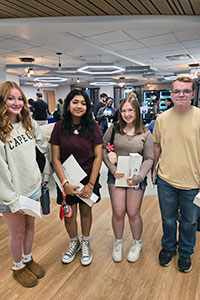 Four new students standing together at Orientation.
