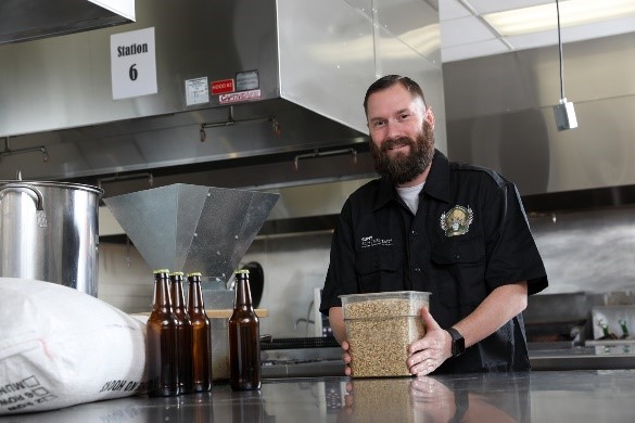 Ryan Trestick in the craft beer brewing lab at SUNY Schenectady.