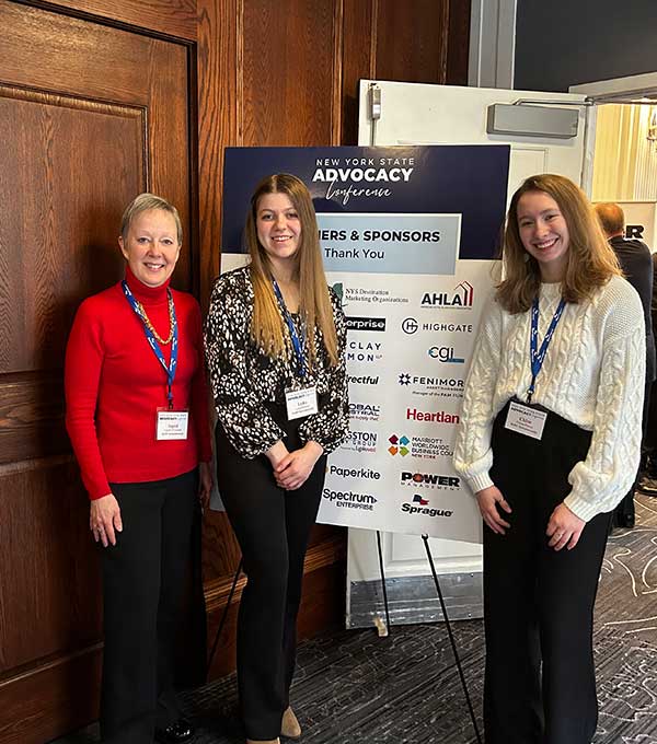 Two MPI students with professor Ingrid O'Connell.