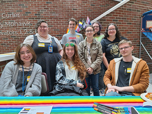 Members and Advisors of the Pride Alliance pose for a picture.