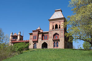 Historic building sits on top of a hill.