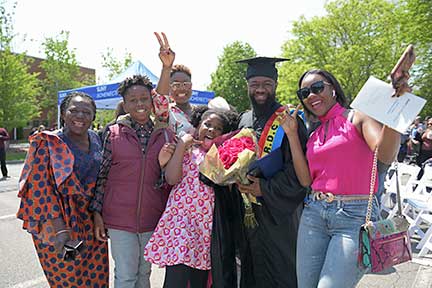 Happy family with their graduate on Commencement Day 2023.