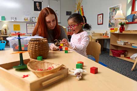 Early Childhood student working with a preschool student in the Laboratory Preschool. 