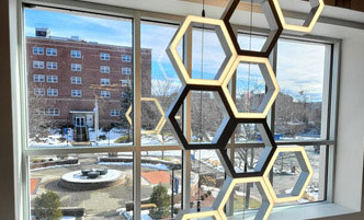 The Quad of SUNY Schenectady from the interior of Begley Learning Commons.