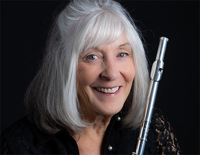 Headshot of Ali Ryerson, holding her flute.