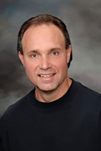 Headshot of Bruce Rogers.