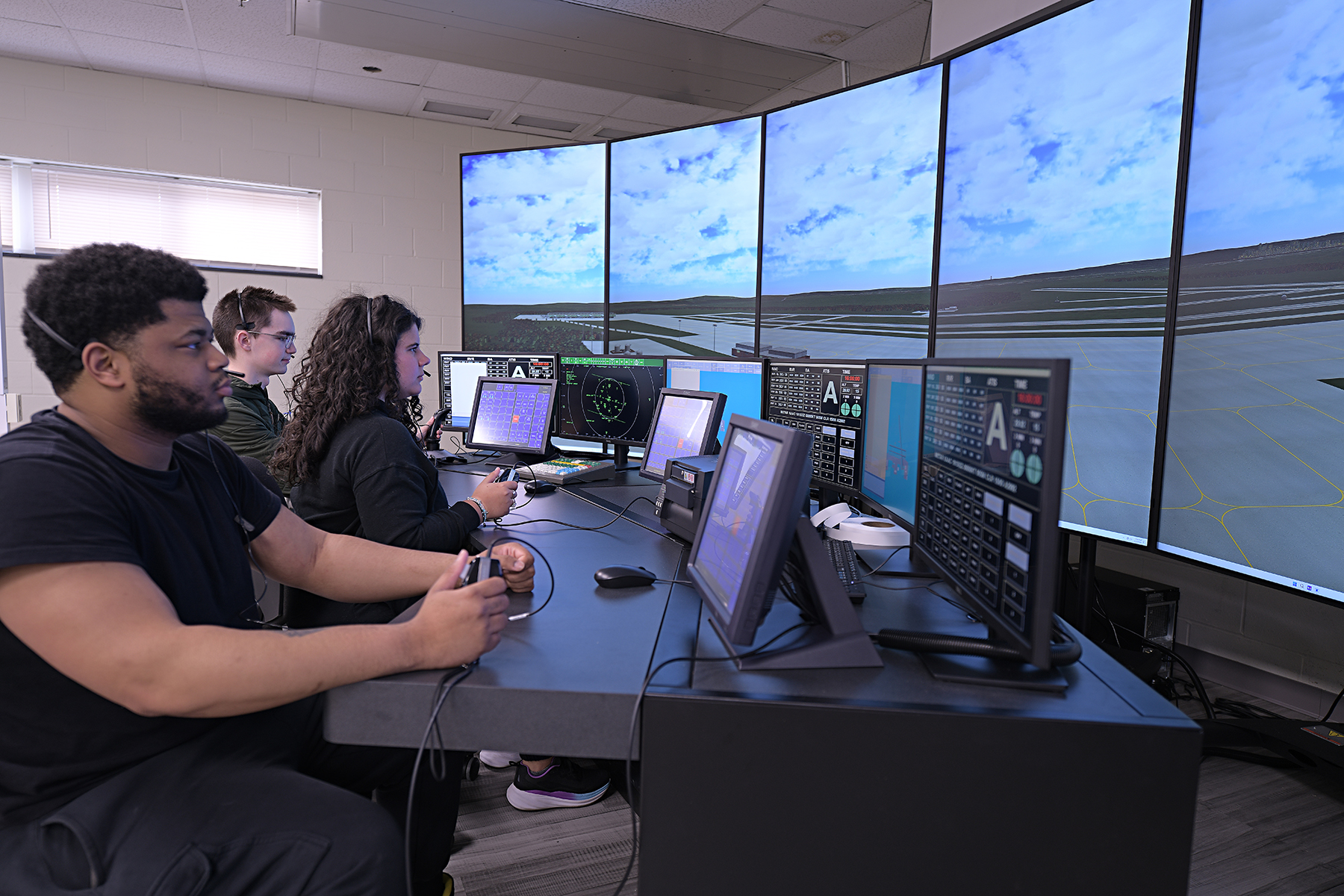Students seated using new Air Traffic Control Simulator