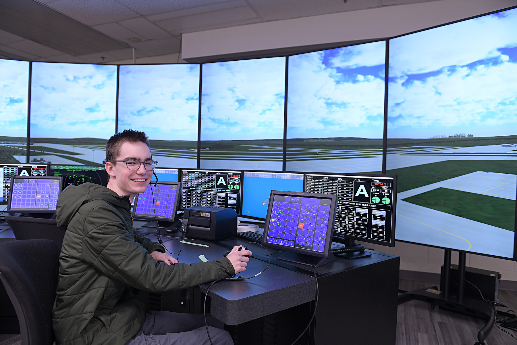 Student, seated, using new Air Traffic Control Simulator