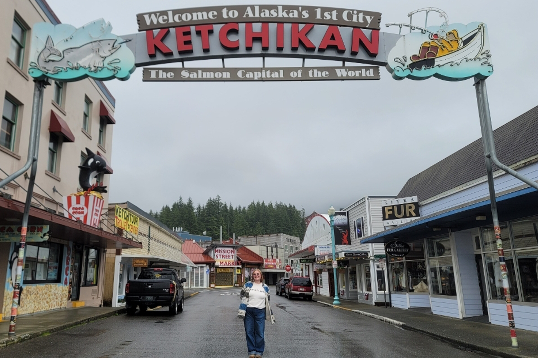 Hospitality and Tourism Management student Ally Becker under the Ketchikan, Alaska sign. 