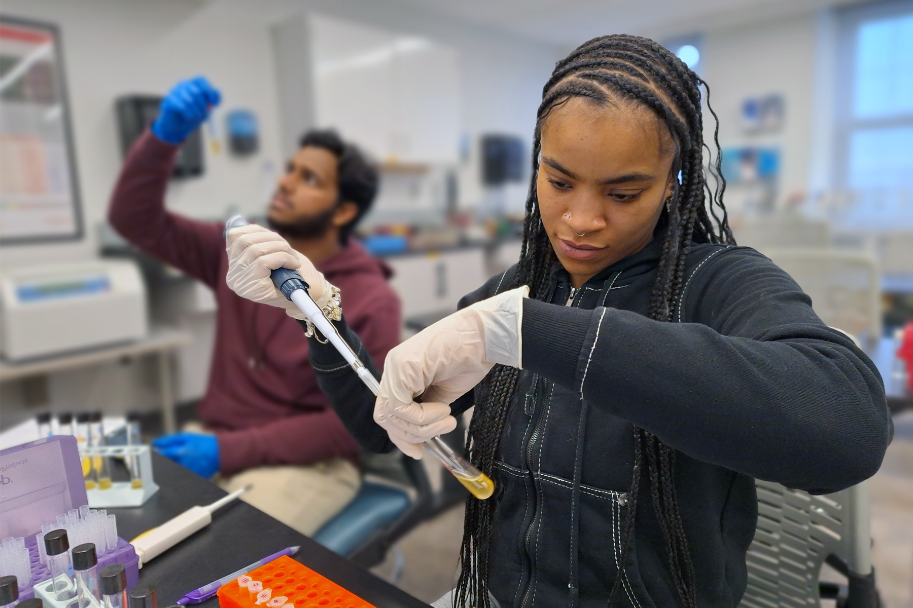Student Siyana Brown using biotech equipment, in Biotechnology Facility