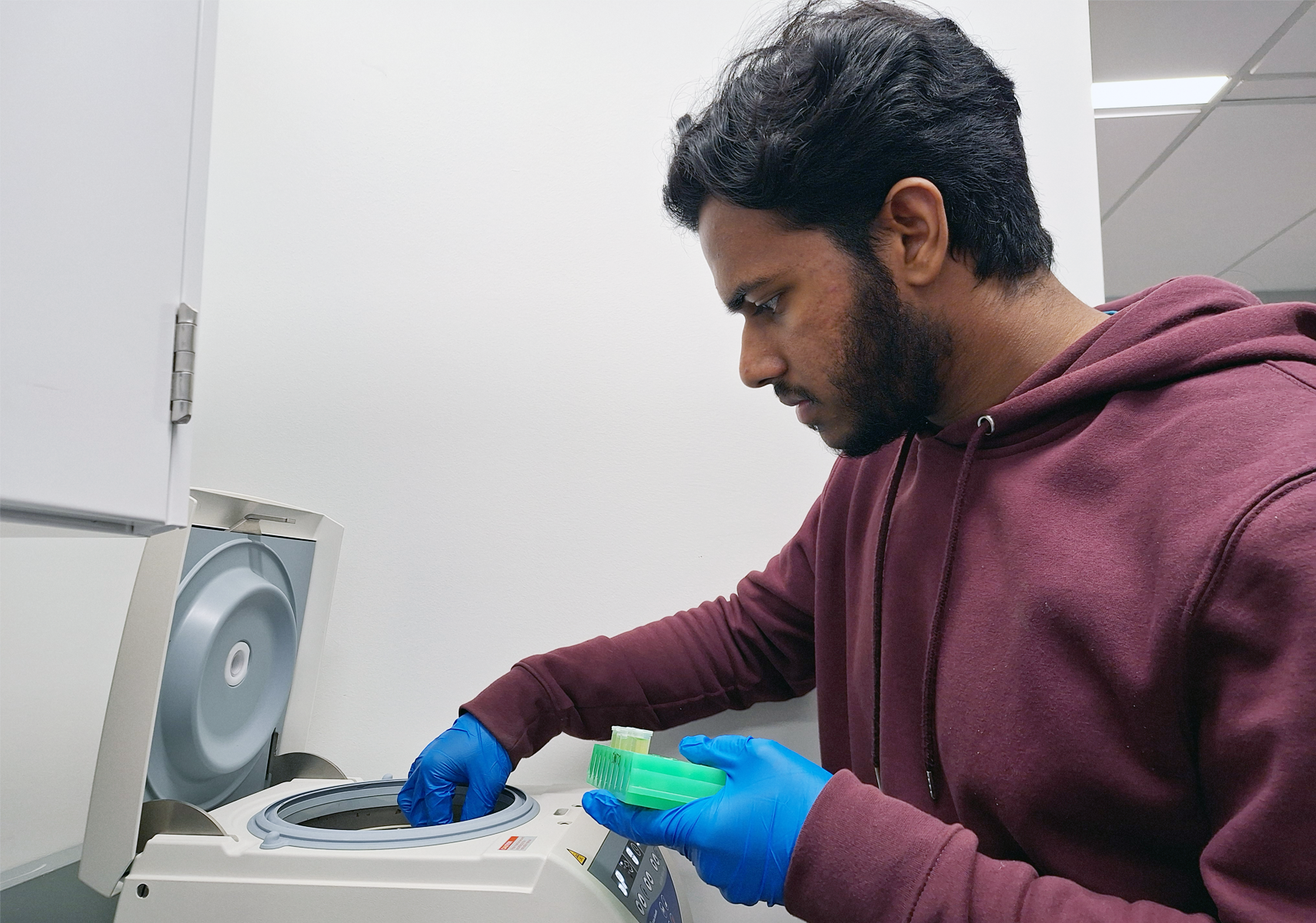 Student using biotechnology equipment in Biotechnology Facility