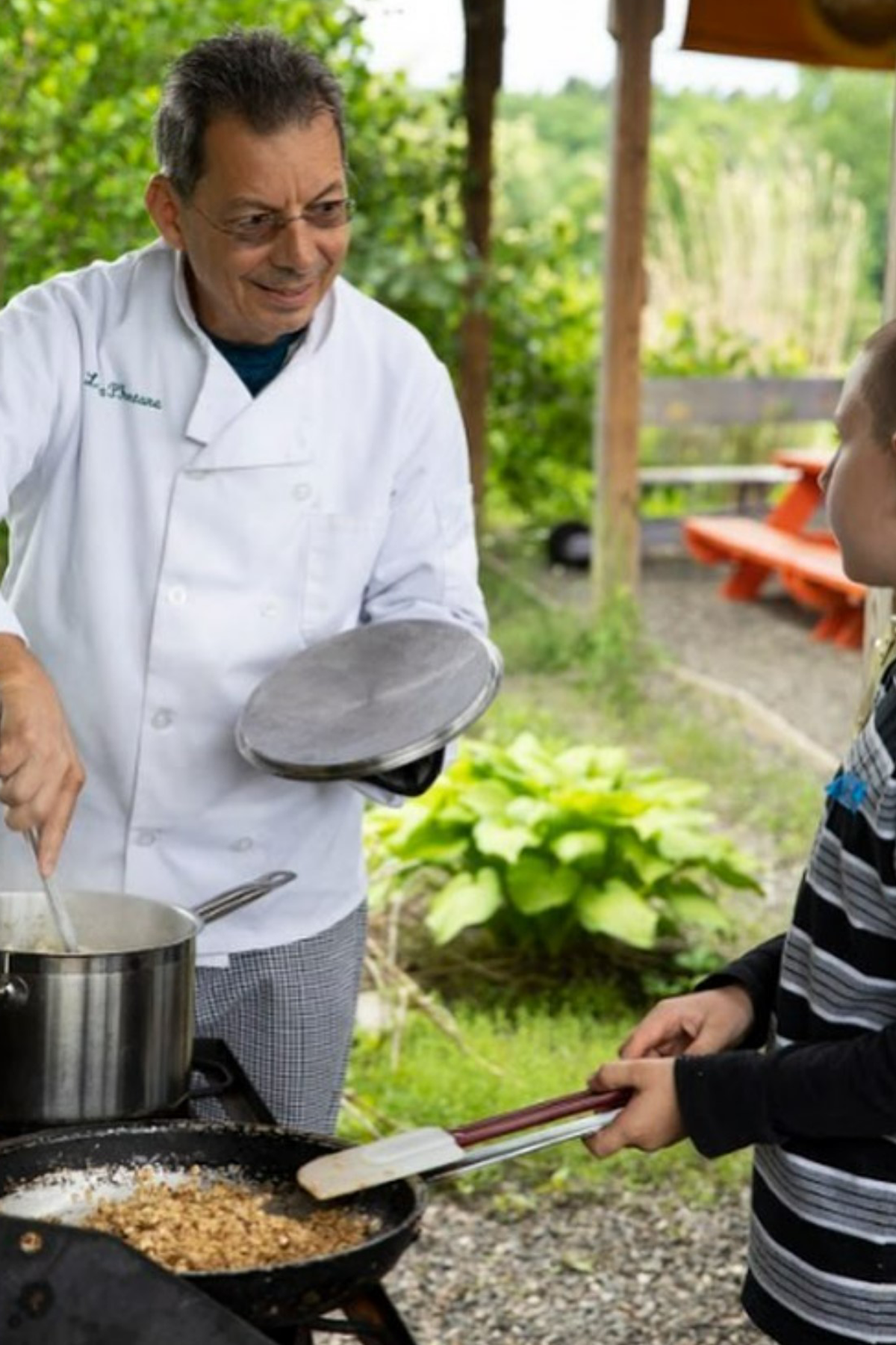 Dr. Luca Fontana in chef's uniform working at The Sylvia Center at Katchkie Farm