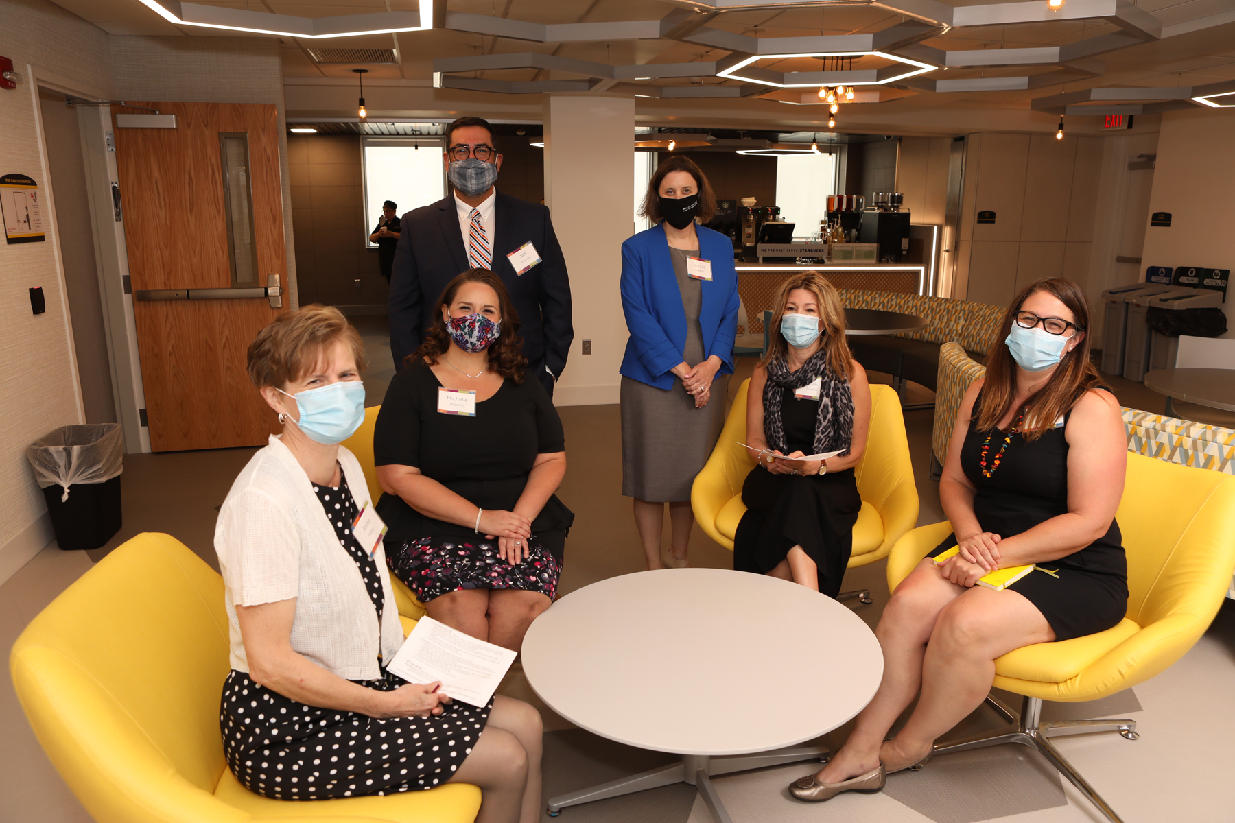 Library staff sitting in new Learning Commons